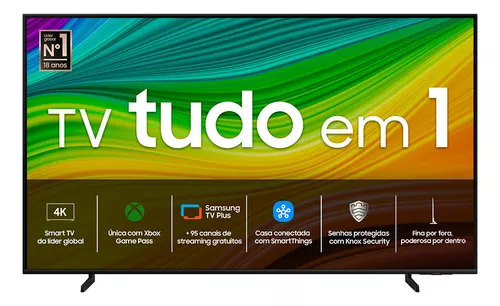 Smart TV Samsung 43 polegadas preta vista de frente sobre fundo branco, tela exibindo padrão abstrato colorido e faixa promocional TV tudo em 1